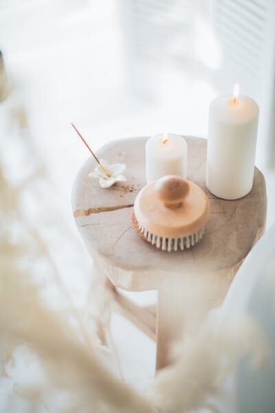 A quiet wellness moment with candlelight and flowers